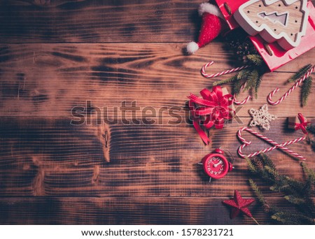 Merry Christmas and Happy New Year. Winter season holiday decoration on wood background.