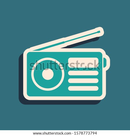 Green Radio with antenna icon isolated on blue background. Long shadow style. 
