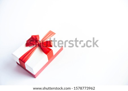 Beautiful Christmas gift box with red ribbon on isolated background. Happy New Year and merry christmas. 