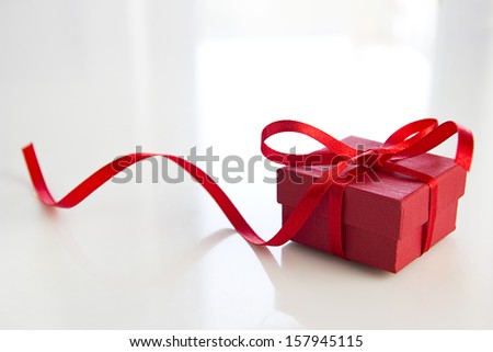 red gift box over white table