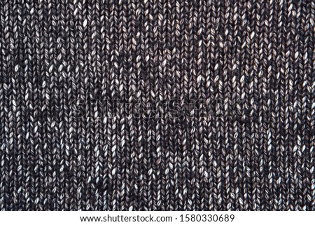 Beautiful melange knitted texture for background. Winter backdrop. Space for text.