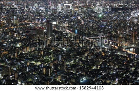 Bright aerial panorama of night illuminated Tokyo