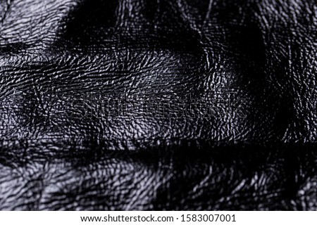 Close-up of a black leather texture background.
