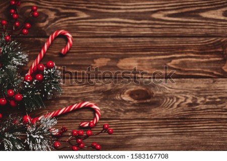 Fir tree branches with Christmas decoration on blue wooden background, flat lay. Space for text