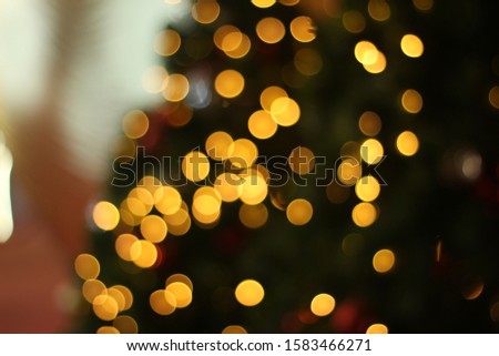 Christmas tree blurred bokeh. Abstract light holiday background