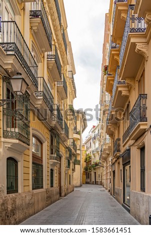 One of the beautiful side streets of Carrer dels Cavallers in Valencia, Spain