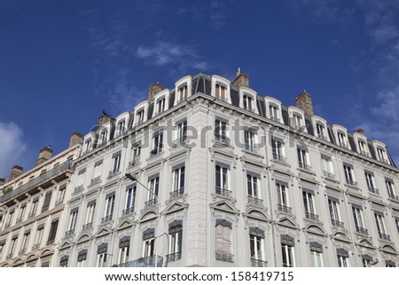 Facade of a traditional apartment building in Lyon, France