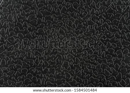 Rough black metal texture background with closeup