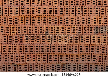 A group of brick block in stack laid on the ground preparing for build a building or houses, Pile of red bricks for construction work, Abstract geometric pattern, Construction equipment.