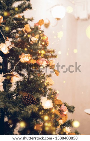 Beautiful Christmas tree with decor against blurred lights on background.