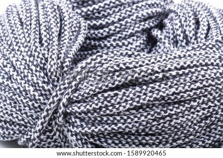 Black-white thick binding stitch on a white background