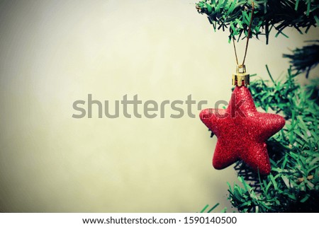 Christmas red star toy on the Christmas tree. New year and Christmas concept.