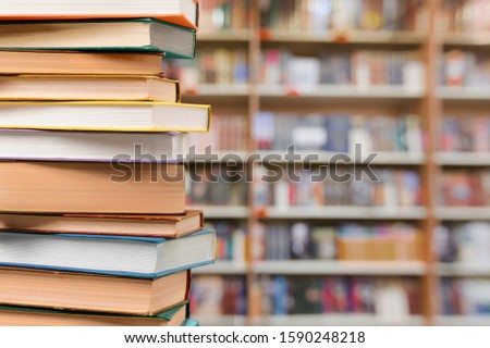 Old antique books stacked on background.