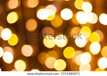 Blur - bokeh Decorative outdoor string lights hanging on tree in the garden at night time 