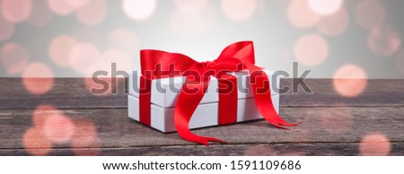Present box with a ribbon