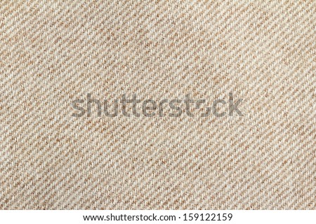 close up of a woolen fabric of beige color 