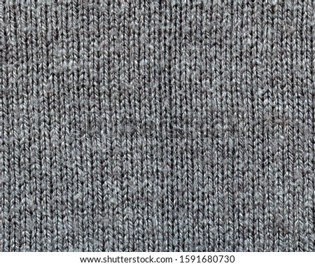 gray knitting texture closeup as background