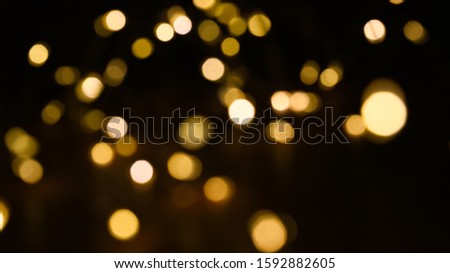 Golden lights in a dark background