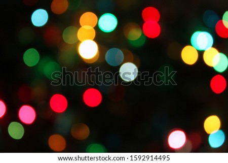 Colorful festive blurry lights of Christmas decorations, bright abstract background