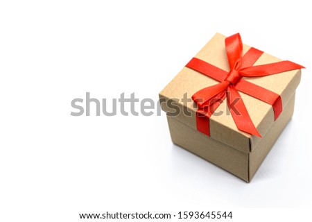 Open gift box Vintage gift wrapping with separate red ribbon bow on white background.