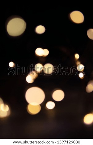 Gold bokeh on the dark background blurred, classic light