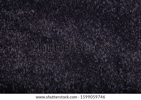 Carpet covering background. Pattern and texture of black carpet. Copy space.
