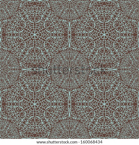 Seamless pattern with openwork circles on a brown background