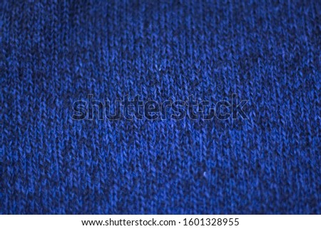 texture of blue melange wool knitted fabric as background