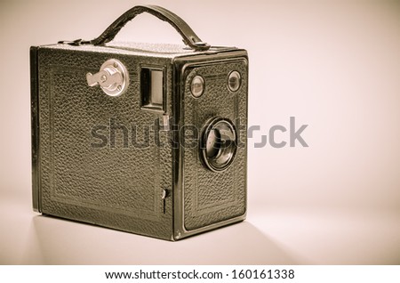 Old box camera in black and white sepia toned