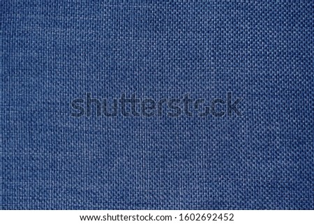 close up of dark blue fabric texture used for backfround. rough cloth texture.