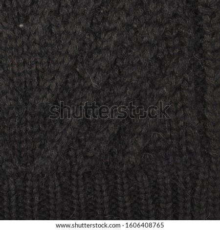 knitted warm background, element of a sweater or scarf. the texture of knitting and yarn is clearly visible