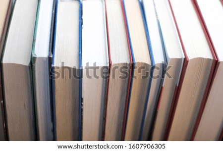 a lot of books are lying on the table on a white background
