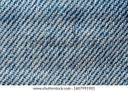 Texture of blue denim jeans macro
