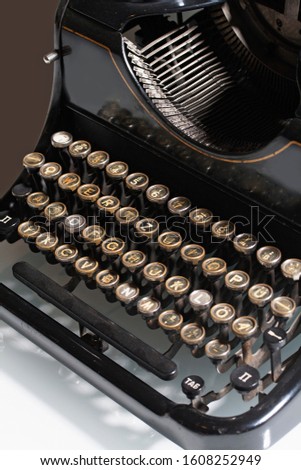 Close-up of a dark and vintage typewriter.