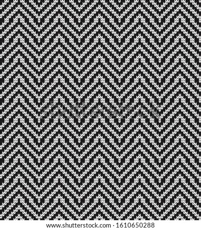Knitted vector seamless decorative black and white wavy pattern