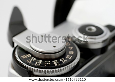 Classic analog single-lens reflex camera isolated on white background.