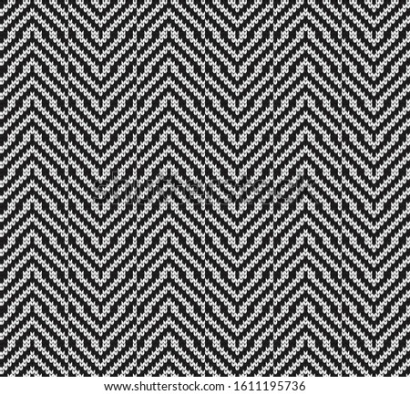 Knitted vector seamless decorative black and white wavy pattern