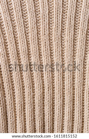 Seamless white knitwear fabric texture. Knitting texture of sweater or scarf or plaid. Knitted white background


