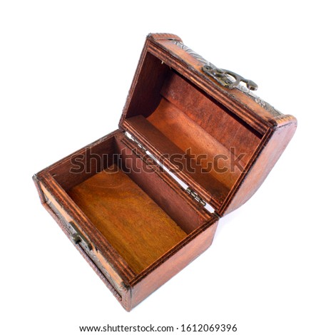 Small wooden decorative casket with a floral pattern, close-up, isolated on a white background