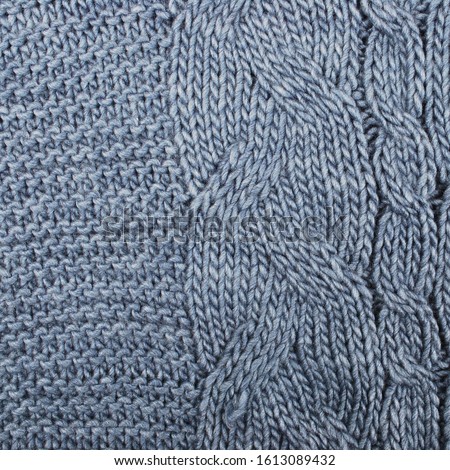 knitted warm background, element of a sweater or scarf. the texture of knitting and yarn is clearly visible