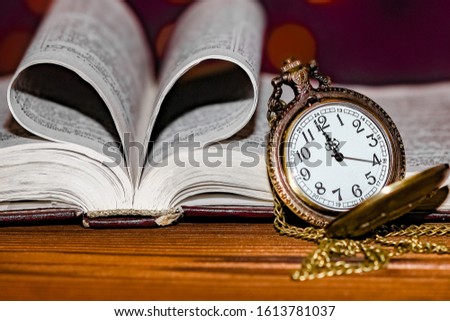 pocket watch with book background