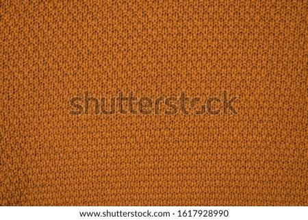 Brown knitted fabric pattern. Warm clothes. 