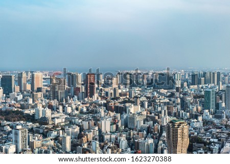 Asia Business concept for real estate and corporate construction - panoramic modern city skyline bird eye aerial view of tokyo tower and vivid blue sky in Roppongi Hill, Tokyo, Japan