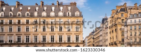 Paris, typical facade and windows, beautiful building rue de Rivoli
