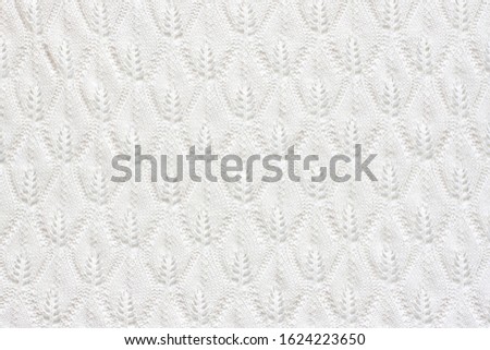 Knitting pattern, white leaves design, lace fabric, handmade openwork knitted stitch mockup