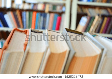 Bookshelf, interior blurred. Intentionally blurred to be used as background
