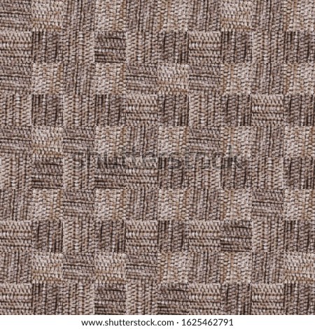 Mosaic texture from fragments of brown upholstery fabric in a large hem. Wallpaper image. Background design. Backdrop.
