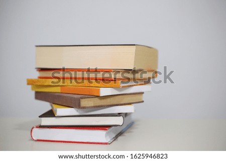 Stack of Books on the table with white backgroun

