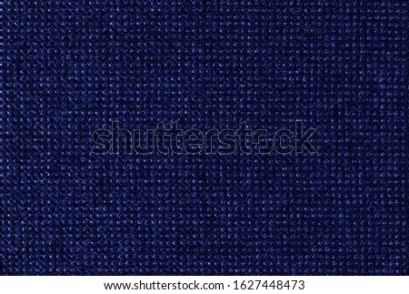 Elegant indigo, ultramarine blue cashmere background texture. Melange fabric with visible weave texture. Expensive men's suit fabric. Virgin wool extra fine. High resolution