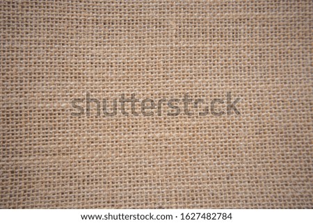 Background, sackcloth, cotton weave, close up with beige scales and different eyebrows, sackcloth has a rough texture and texture in dark brown and beige tones for backgrounds and decoration  vintage.
